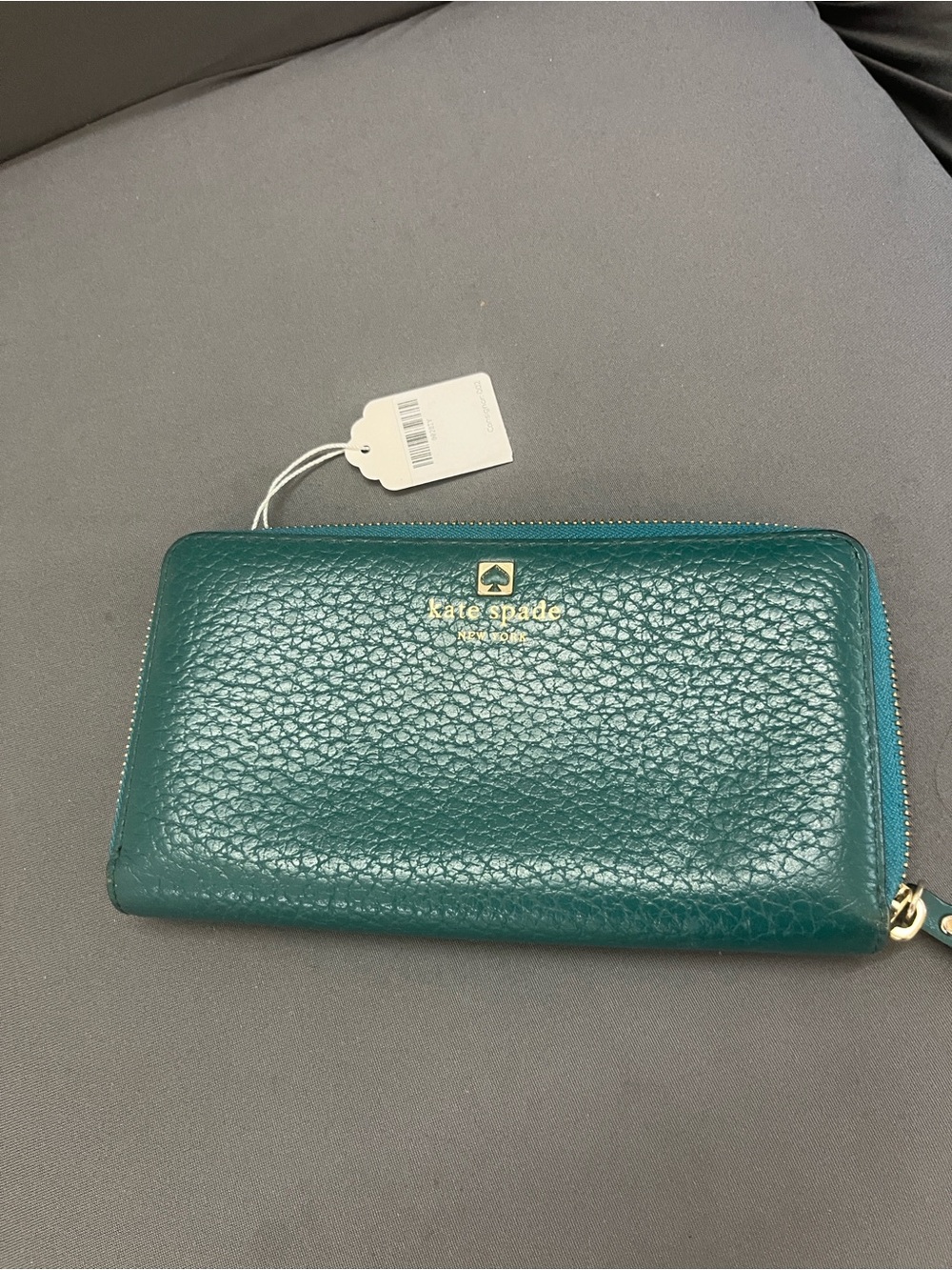 kate spade teal pebbled zip-around wallet with gold logo